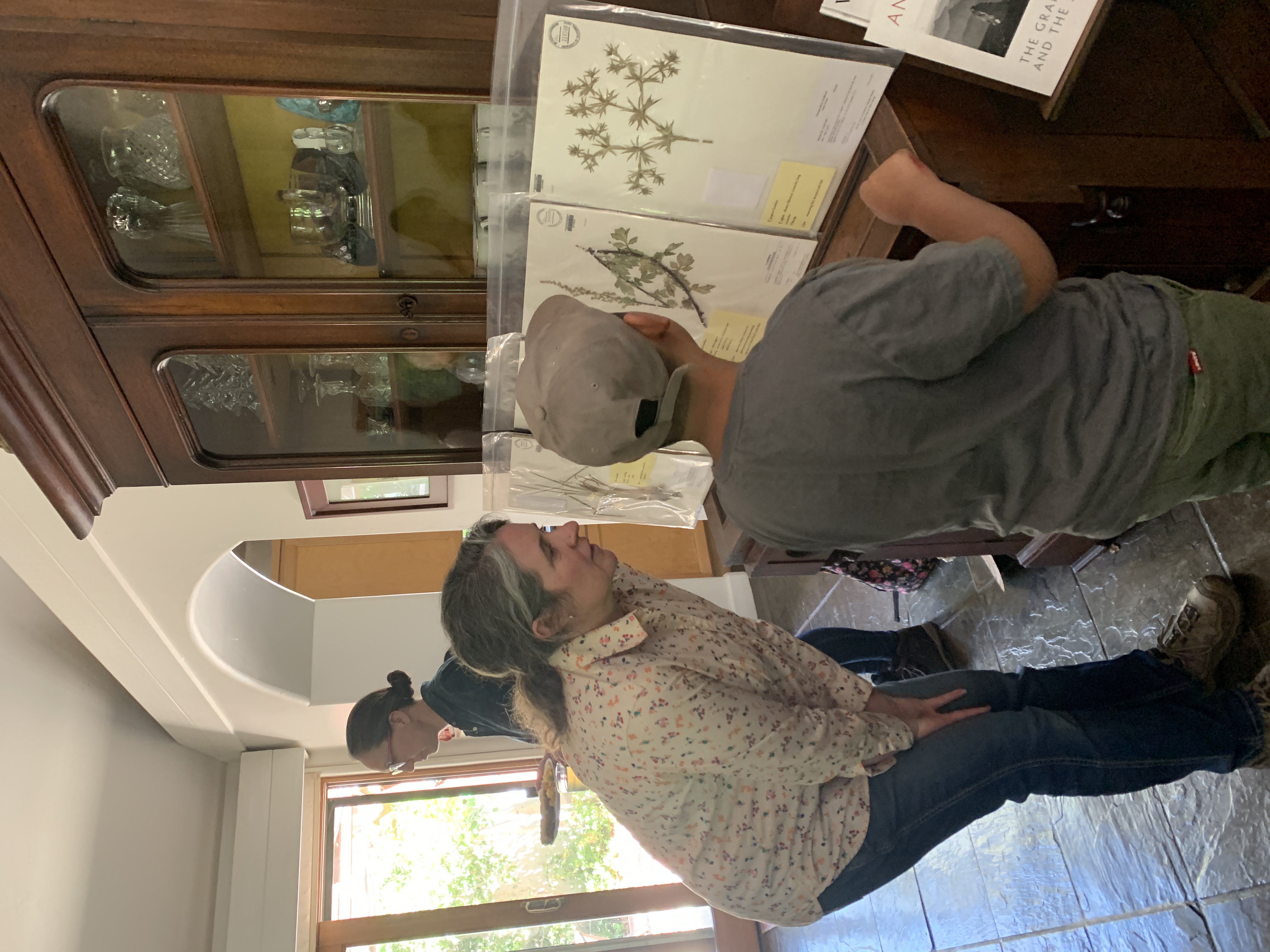 Two participants looking at plant vouchers together 